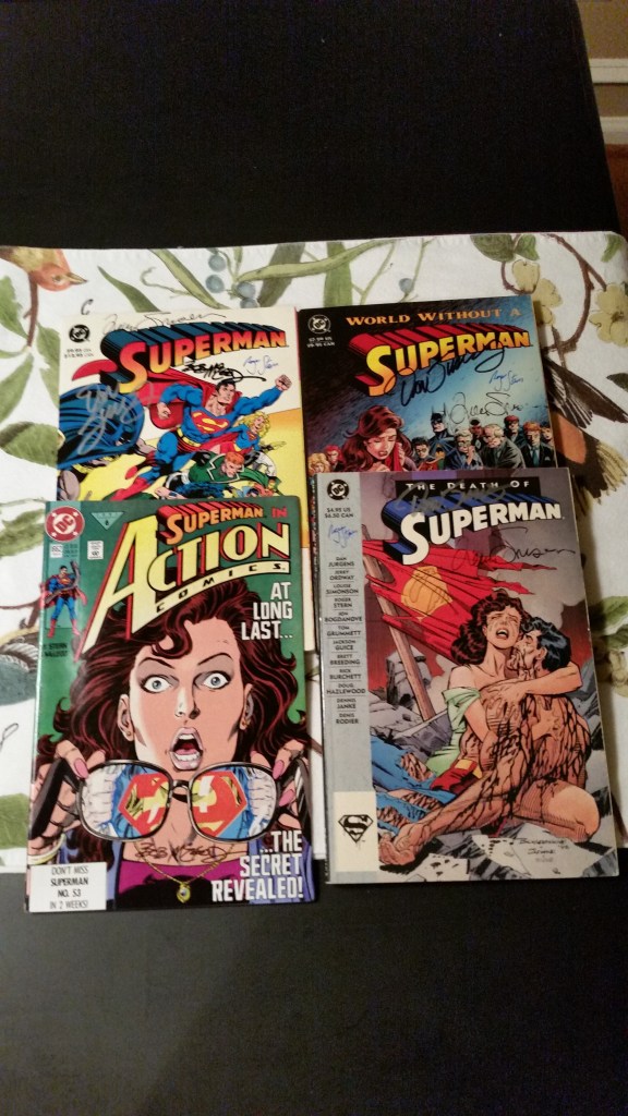 Superman books and trades I added signatures to.